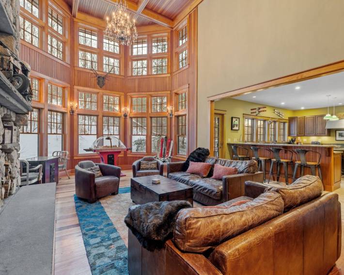 The living room of a contemporary rustic home in the mountains